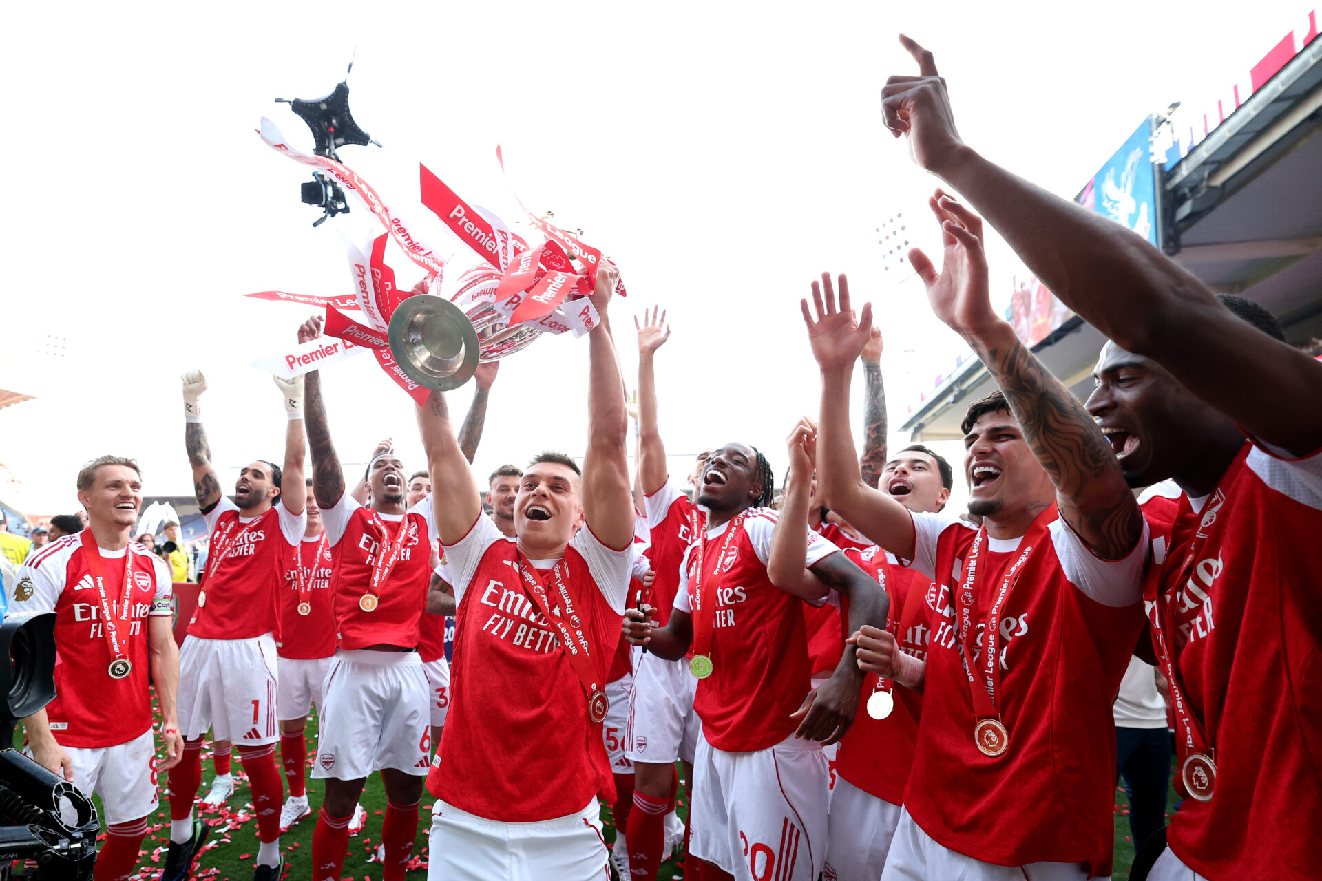 Best photos as Arsenal lift Premier League trophy 7 LONDON, ENGLAND - MAY 24: Leandro Trossard of Arsenal lifts the Premier League trophy, as Arsenal are crowned the Champions of the Premier League for the 2025/26 Season, after the Premier League match between Crystal Palace and Arsenal at Selhurst Park on May 24, 2026 in London, England. (Photo by Michael Regan/Getty Images For Premier League)