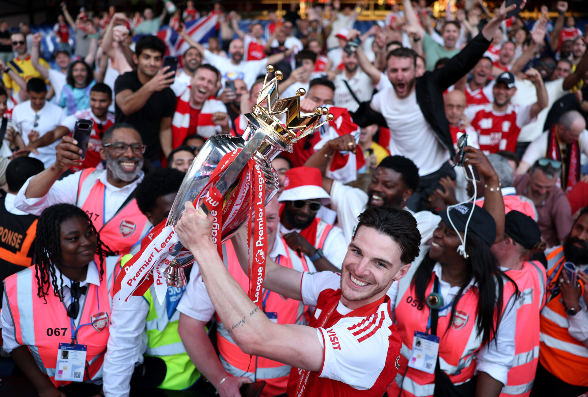 Best photos as Arsenal lift Premier League trophy 24 LONDON, ENGLAND - MAY 24: Declan Rice of Arsenal celebrates with the Premier League trophy as players of Arsenal celebrate, as they are crowned the Champions of the Premier League for the 2025/26 Season, after the Premier League match between Crystal Palace and Arsenal at Selhurst Park on May 24, 2026 in London, England. (Photo by Justin Setterfield/Getty Images)