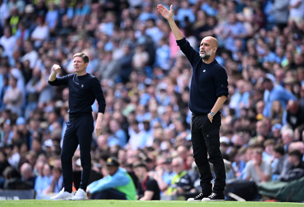 Oliver Glasner, Manager of Crystal Palace, looks on as Pep Guardiola, Manager of Manchester City, gestures during the Premier League match between Manchester City FC and Crystal Palace FC at Etihad Stadium on April 12, 2025 in Manchester, England.