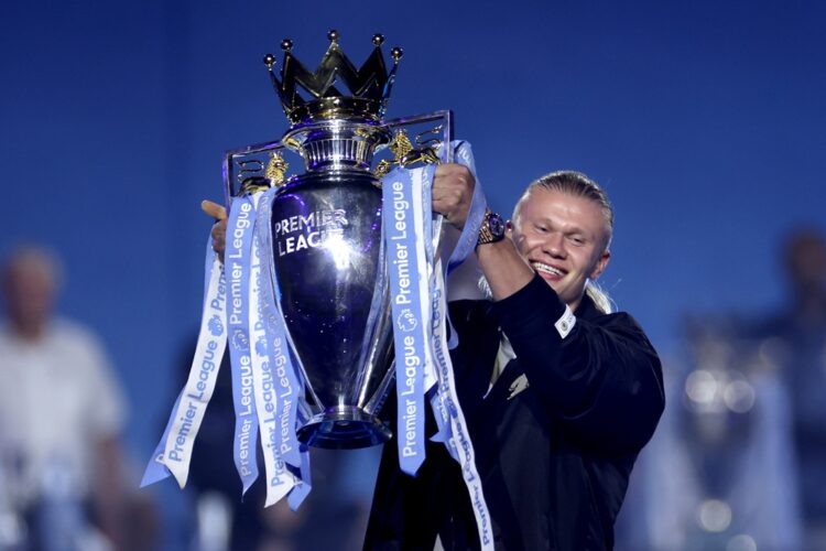 Erling Haaland of Manchester City brings out the 2022/2023 Premier League trophy during the After Party Celebration to mark the achievements of Man...