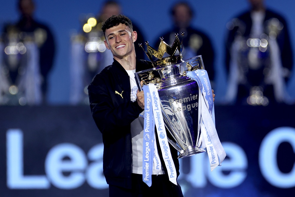 Phil Foden of Manchester City brings out the 2023/2024 Premier League trophy during the After Party Celebration to mark the achievements of Manchester City men’s, women’s and academy teams during the 25/26 season at The Co-op Live Arena on May 25, 2026 in Manchester, England. (Photo by Lewis Storey/Getty Images)