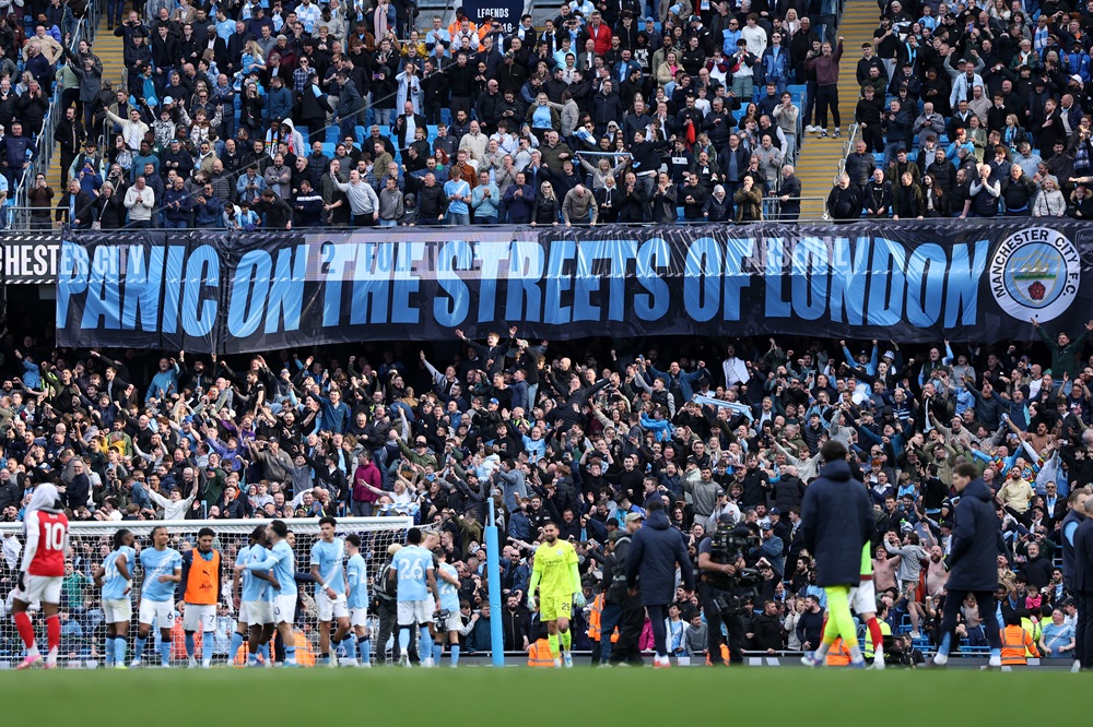 Manchester City fans display a banner which reads 'Panic on the streets of London' after their team's victory in the Premier League match between Manchester City and Arsenal at Etihad Stadium on April 19, 2026 in Manchester, England. (Photo by Michael Regan/Getty Images)