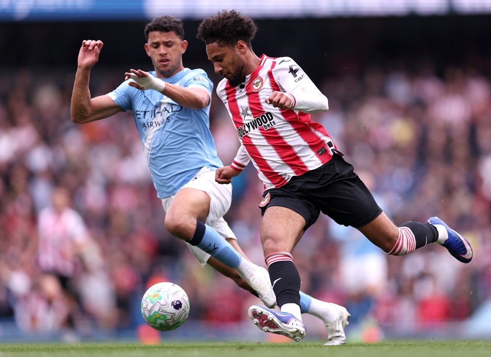 Kevin Schade of Brentford runs with the ball under pressure from Matheus Nunes of Manchester City during the Premier League match between Manchester City and Brentford at Etihad Stadium on May 09, 2026 in Manchester, England. (Photo by Naomi Baker/Getty Images)