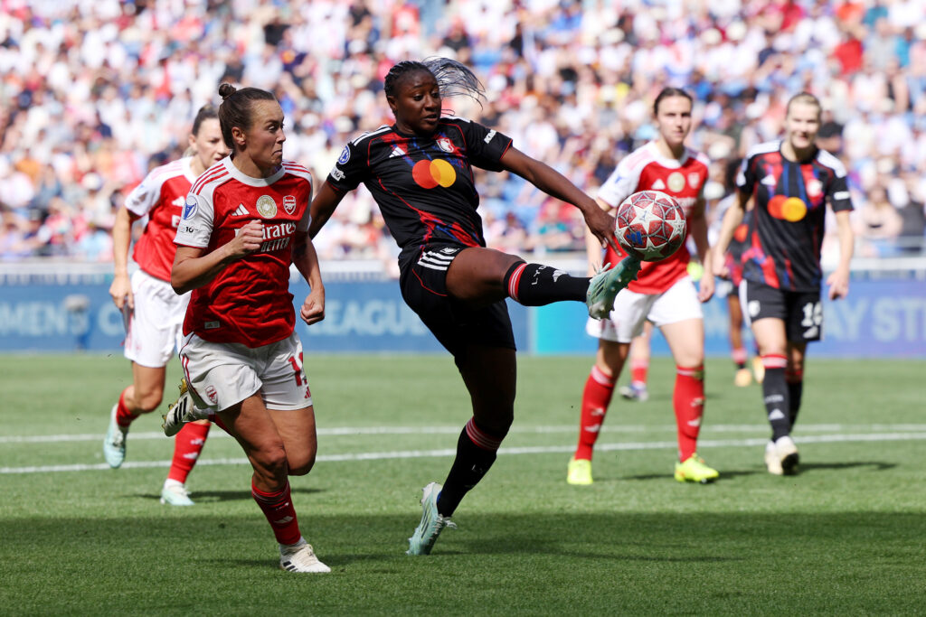 Kadidiatou Diani of OL Lyonnes controls the ball while under pressure from Caitlin Foord of Arsenal during the UEFA Women's Champions League 2025/26 Semi-Final Second Leg match between OL Lyonnes and Arsenal FC at OL Stadium on May 02, 2026 in Decines-Charpieu, France.