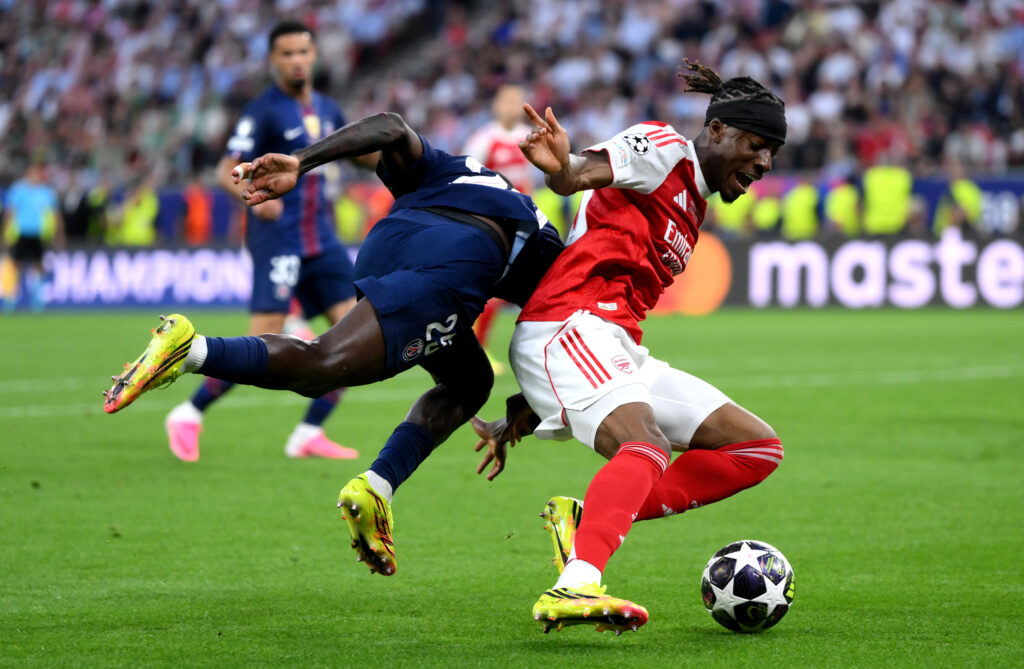 Noni Madueke of Arsenal is challenged by Nuno Mendes of Paris Saint-Germain during the UEFA Champions League Final 2026 match between Paris Saint-Germain and Arsenal FC at Puskas Arena on May 30, 2026 in Budapest