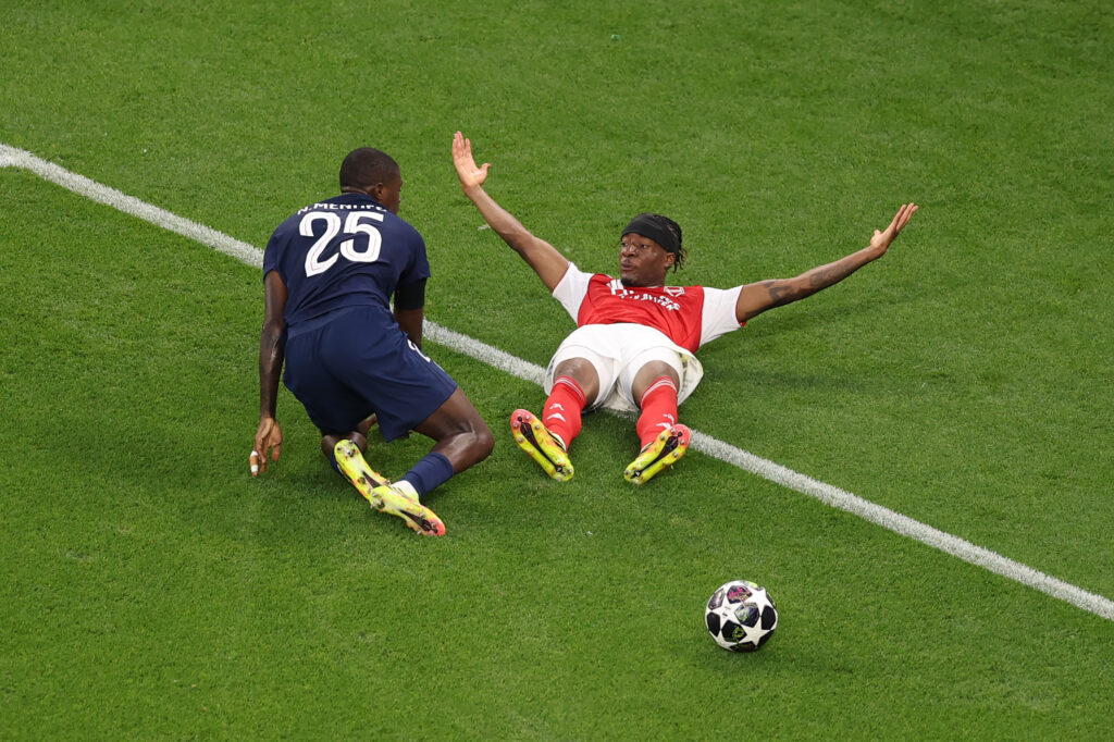 Noni Madueke of Arsenal reacts as he goes down following a challenge from Nuno Mendes of Paris Saint-Germain during the UEFA Champions League Final 2026 match between Paris Saint-Germain and Arsenal FC at Puskas Arena on May 30, 2026 in Budapest, Hungary