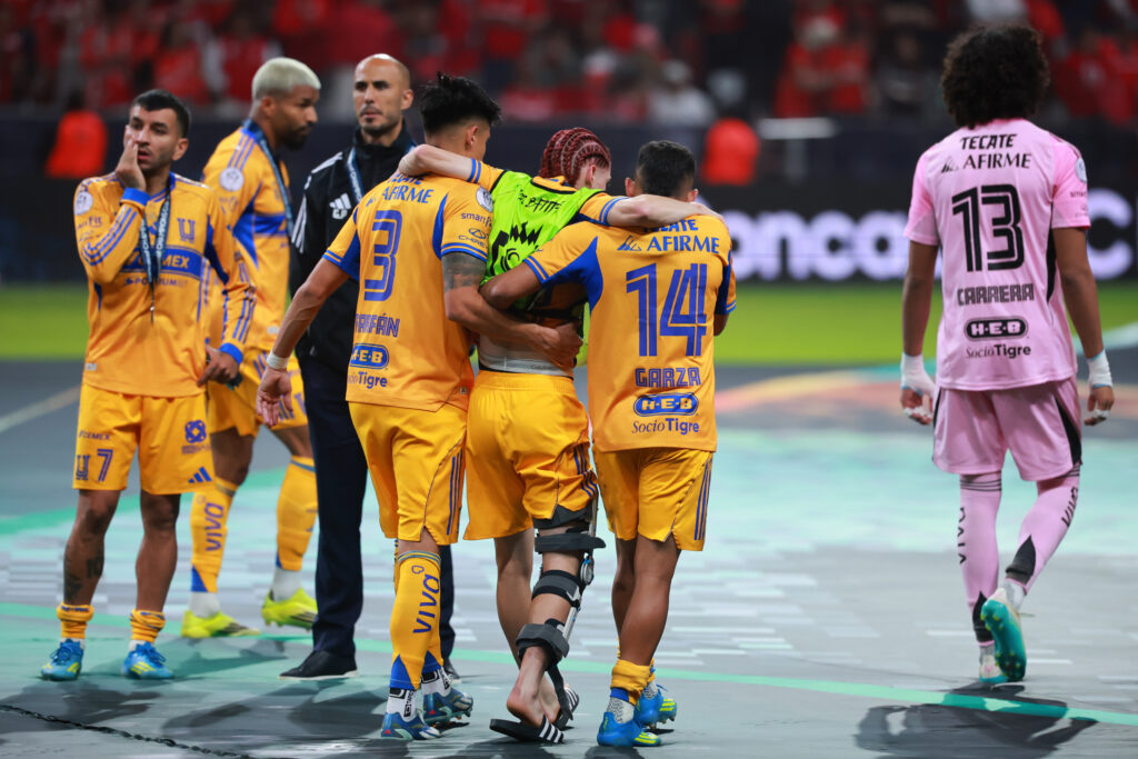 Ex-Arsenal youngster suffers knee injury ahead of World Cup 2 Marcelo Flores of Tigres UANL is helped by teammates to receive the runners-up medal after the CONCACAF Champions Cup 2026 final match between Toluca and Tigres UANL at Nemesio Diez Stadium on May 30, 2026 in Toluca