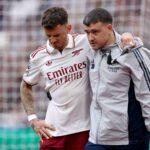 Ben White of Arsenal leaves the pitch after picking up an injury during the Premier League match between West Ham United and Arsenal at London Stadium on May 10, 2026 in London, England.