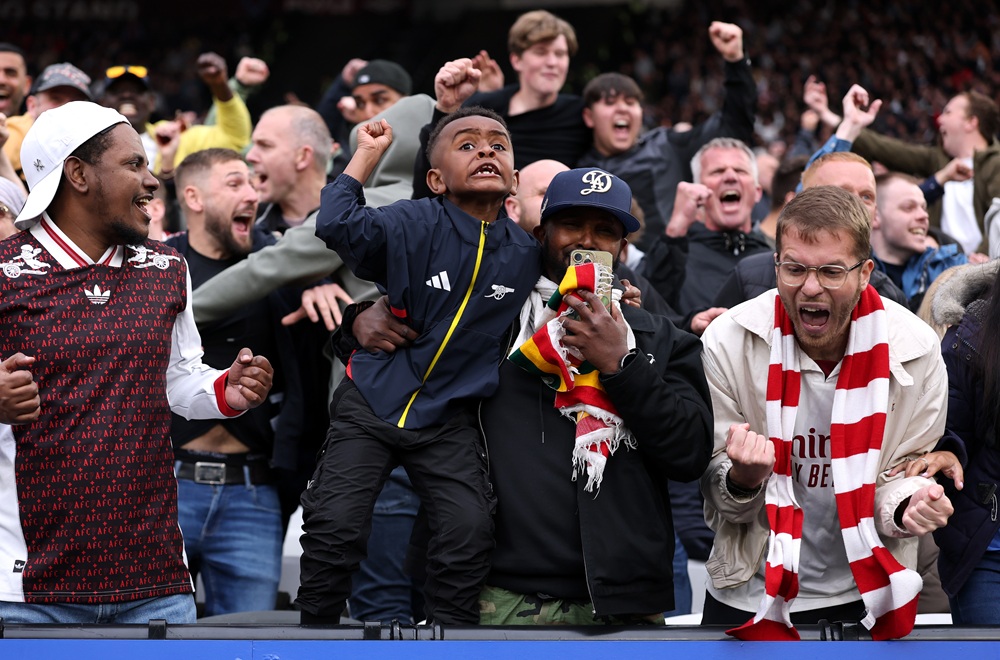 Arsenal fans celebrate after the VAR review concerning a foul on David Raya of Arsenal (not pictured) by Pablo of West Ham United (not pictured) is given as no goal during the Premier League match between West Ham United and Arsenal at London Stadium on May 10, 2026 in London, England. (Photo by Justin Setterfield/Getty Images)