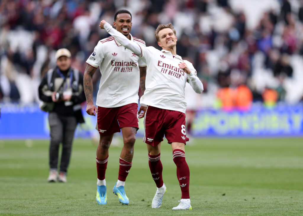 Martin Odegaard of Arsenal celebrates at full time following victory during the Premier League match between West Ham United and Arsenal at London Stadium on May 10, 2026 in London, England.