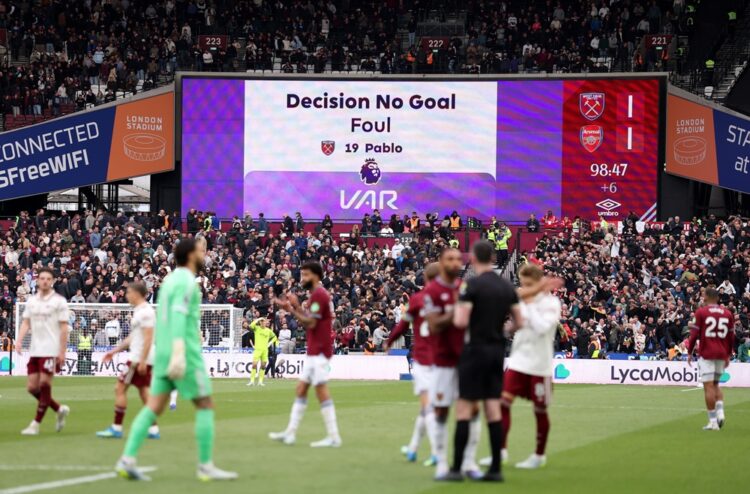 The LED board displays the VAR decision that disallowed the goal scored by Callum Wilson of West Ham United, after Pablo of West Ham United fouled ...