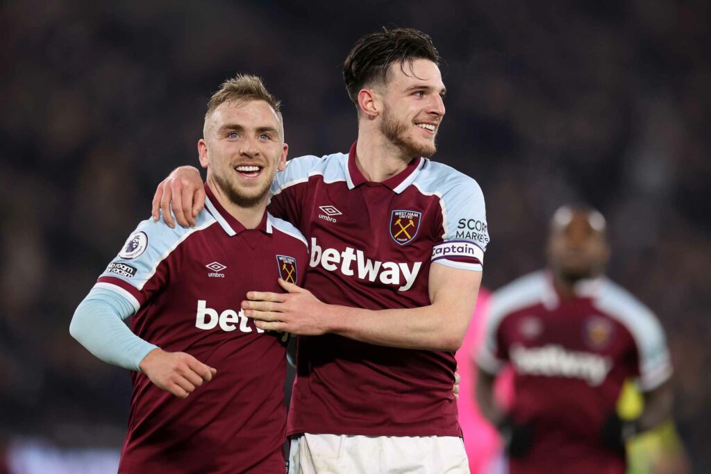 Jarrod Bowen of West Ham United celebrates after scoring their side's second goal with Declan Rice during the Premier League match between West Ham United and Norwich City at London Stadium on January 12, 2022 in London, England.