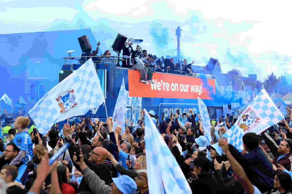 A general view as players of Coventry City celebrate on an open tour bus as fans line to the street and celebrate during Coventry City Trophy Parade on May 04