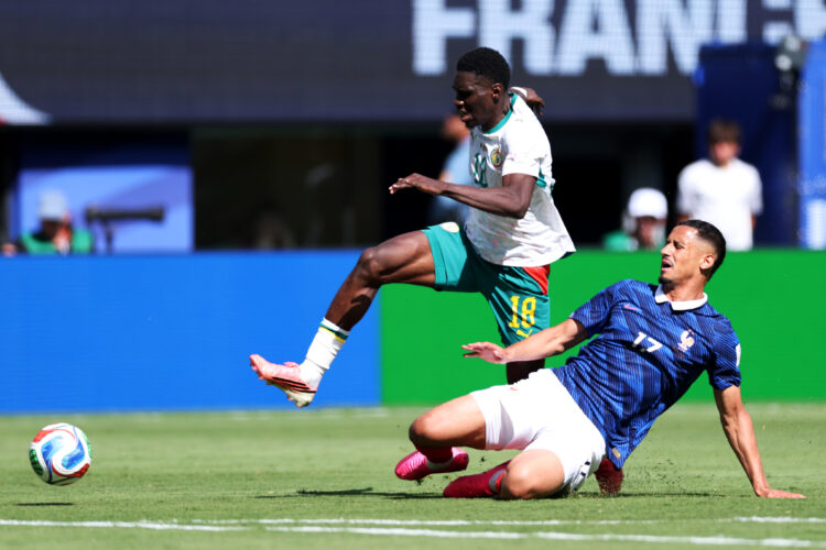 Ismaila Sarr #18 of Senegal is challenged by William Saliba #17 of France during the FIFA World Cup 2026 Group I match between France and Senegal a...