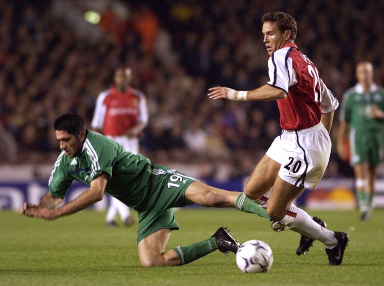 16 Oct 2001: Matthew Upson of Arsenal wins the ball as Michalis Konstantinou of Panathinaikos dives out of his way during the UEFA Champions League...