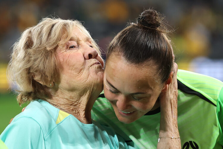 Caitlin Foord of Australia receives a kiss from her grandmother during a presentation for her 150th appearance during the women's international fri...