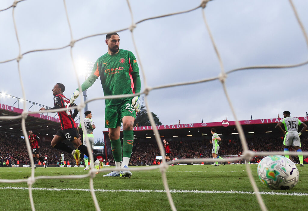Eli Junior Kroupi of AFC Bournemouth celebrates scoring his team's first goal as Gianluigi Donnarumma of Manchester City appears dejected during the Premier League match between Bournemouth and Manchester City