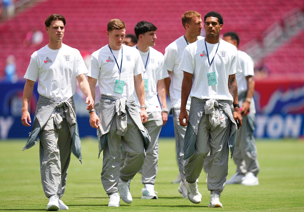 Alex Scott, Elliot Anderson and Jarell Quansah #26 of England inspect the pitch prior to the international friendly match between England and New Zealand at Raymond James Stadium on June 06, 2026 in Tampa, Florida. (Photo by Rich Storry/Getty Images)