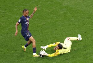 Bradley Barcola of Paris Saint-Germain attempts to shoot past David Raya of Arsenal during the UEFA Champions League Final 2026 match between Paris Saint-Germain and Arsenal FC at Puskas Arena on May 30, 2026 in Budapest, Hungary. (Photo by Richard Heathcote/Getty Images)