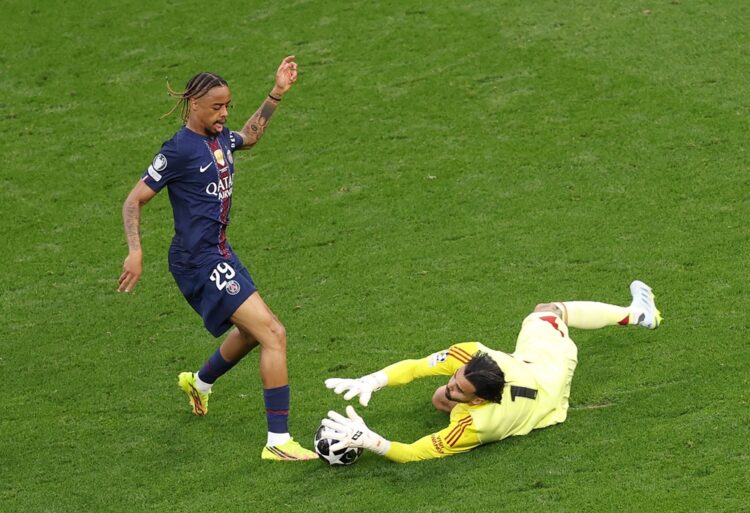 Bradley Barcola of Paris Saint-Germain attempts to shoot past David Raya of Arsenal during the UEFA Champions League Final 2026 match between Paris...