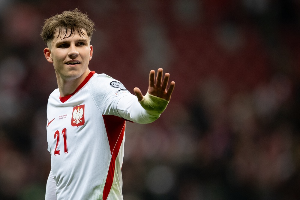 Oskar Pietuszewski of Poland celebrates after the team's victory during the FIFA World Cup 2026 European Qualifiers KO play-offs match between Pola...