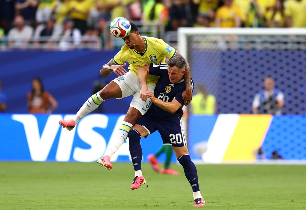Gabriel Magalhaes #3 of Brazil competes for a header against Lawrence Shankland #20 of Scotland during the FIFA World Cup 2026 Group C match between Scotland and Brazil at Miami Stadium on June 24, 2026 in Miami Gardens, Florida. (Photo by Megan Briggs/Getty Images)
