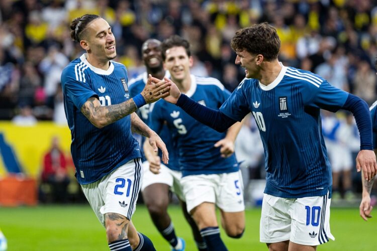 Kostas Tsimikas of Greece celebrates with teammate Christos Tzolis after scoring the 0-1 goal during the international friendly match between Swede...