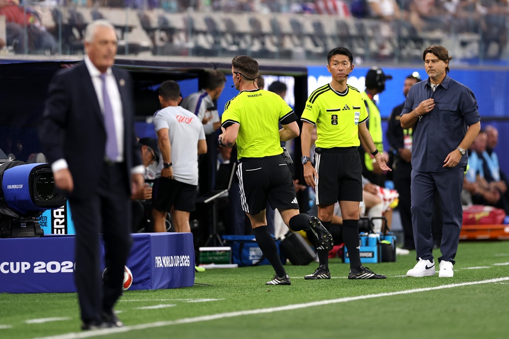 Referee Danny Makkelie goes to check the VAR screen as a VAR check is underway for 'mistaken identify' involving an tackle between Miguel Almiron #10 of Paraguay and Tim Ream #13 of the United States during the FIFA World Cup 2026 Group D match between USA and Paraguay at Los Angeles Stadium on June 12, 2026 in Los Angeles, California. (Photo by Richard Heathcote/Getty Images)