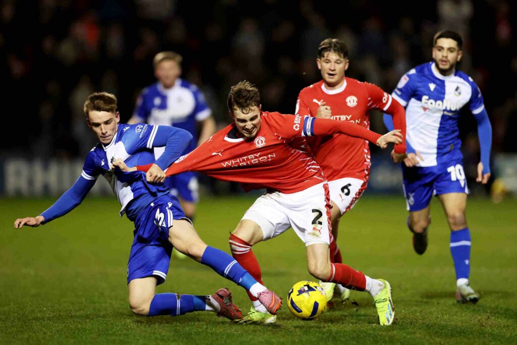 Ollie Dewsbury of Bristol Rovers FC is challenged by Lewis Billington of Crewe Alexandra during the Sky Bet League Two match between Crewe Alexandra and Bristol Rovers at Mornflake Stadium on December 19, 2025 in Crewe