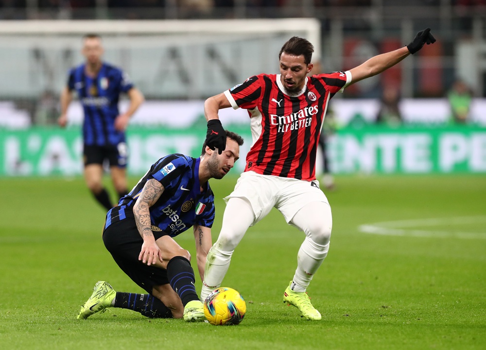Former Gunner to terminate AC Milan contract by mutual consent 2 Ismael Bennacer of AC Milan is put under pressure by Hakan Calhanoglu of FC Internazionale during the Serie A match between AC Milan and FC Internazionale at Stadio Giuseppe Meazza on February 02, 2025 in Milan, Italy. (Photo by Marco Luzzani/Getty Images)