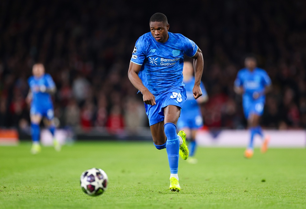 Christian Kofane of Bayer 04 Leverkusen runs with the ball during the UEFA Champions League 2025/26 Round of 16 Second Leg match between Arsenal FC and Bayer 04 Leverkusen at Arsenal Stadium on March 17, 2026 in London, England. (Photo by Warren Little/Getty Images)