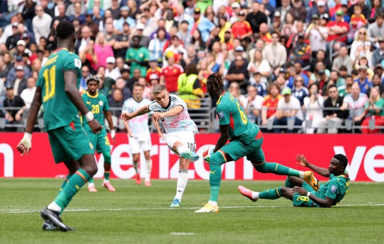 Leandro Trossard #10 of Belgium shoots at goal blocked by Pathe Ciss #6 of Senegal during the FIFA World Cup 2026 Round Of 32 match between Belgium...