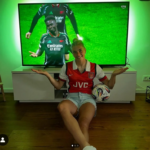 selina cecri wearing an old Arsenal shirt, copying Bukayo Saka's shrug