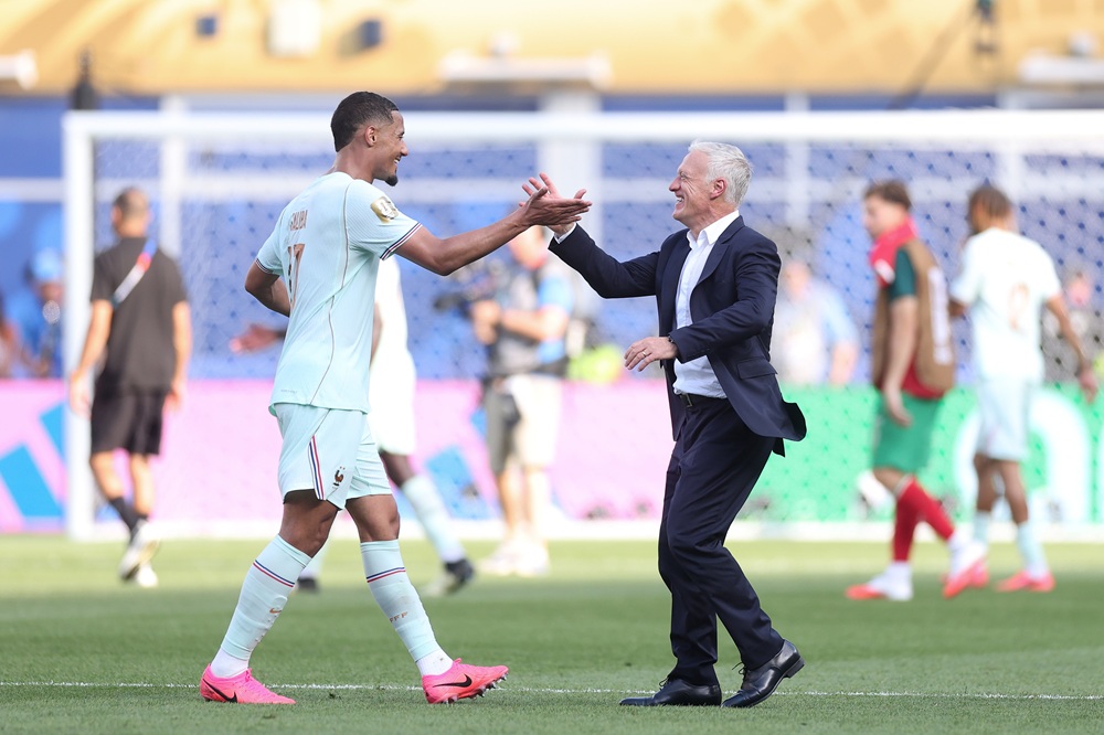 Didier Deschamps, Head Coach of France, celebrates with William Saliba #17 after the 2-0 victory during the FIFA World Cup 2026 Quarter Final match...