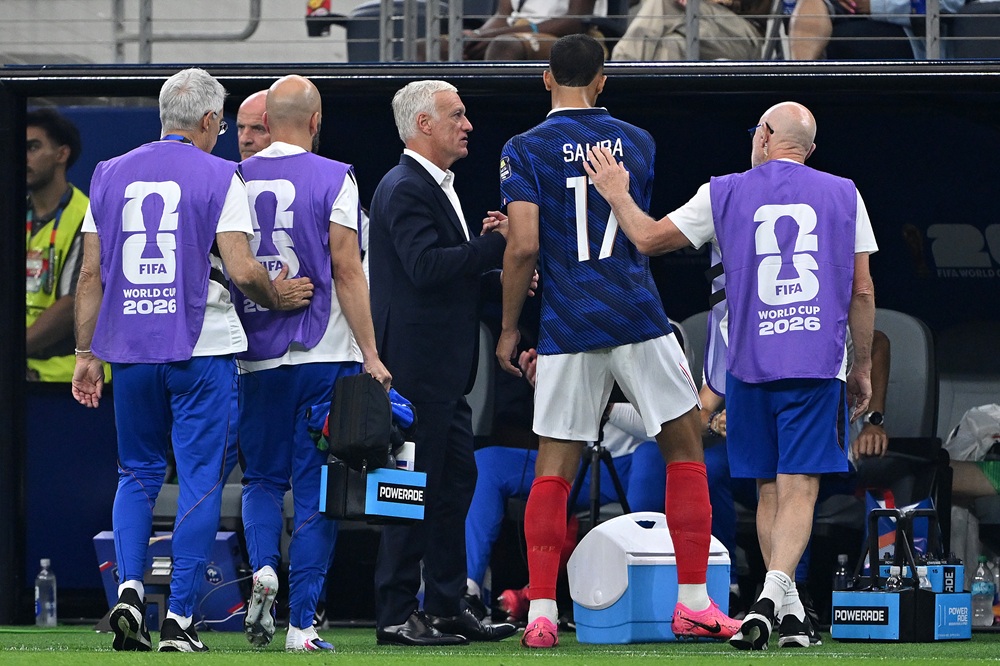 What Saliba said before France injury substitution 3 Didier Deschamps, Head Coach of France, checks on William Saliba #17 after he comes off with an injury during the FIFA World Cup 2026 Semi Final match between France and Spain at Dallas Stadium on July 14, 2026 in Arlington, Texas. (Photo by Shaun Botterill/Getty Images)