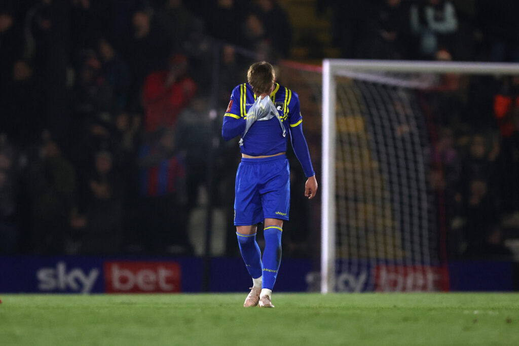 Ollie Dewsbury of Weston-super-Mare reacts after they concede a third goal during the Emirates FA Cup Third Round match between Grimsby Town and Weston Super Mare at Blundell Park on January 10, 2026