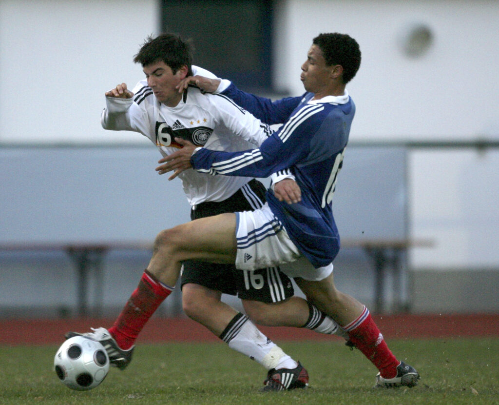 Marco Terrazzino of Germany (L) battles for the ball with Francis Coquelin of France (R) during the U18 International friendly match between Germany and France at the stadium am Bad on March 24, 2009 