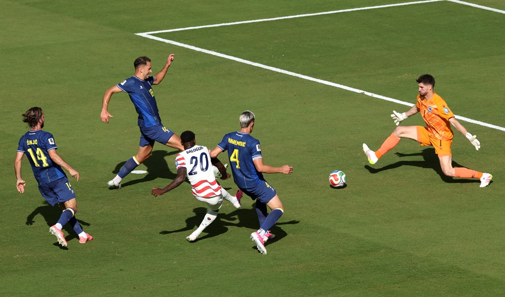 Folarin Balogun #20 of the United States scores his team's first goal past Nikola Vasilj #1 of Bosnia and Herzegovina during the FIFA World Cup 2026 Round of 32 match between USA and Bosnia and Herzegovina at San Francisco Bay Area Stadium on July 01, 2026 in Santa Clara, California. (Photo by Michael Steele/Getty Images)