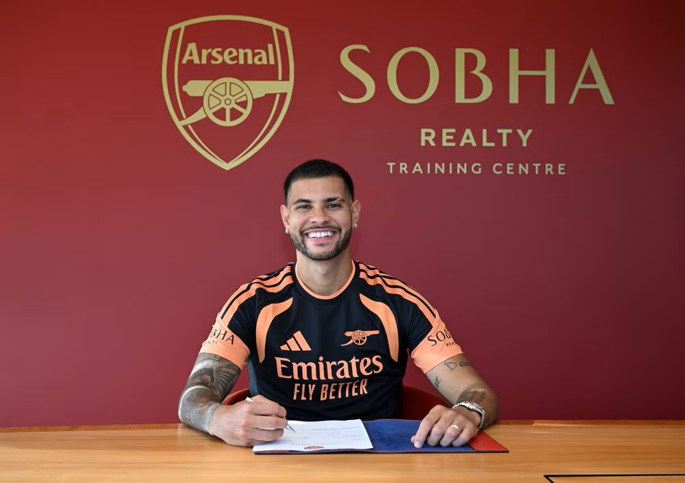 Bruno Guimaraes signing for Arsenal (Photo via Arsenal.com)