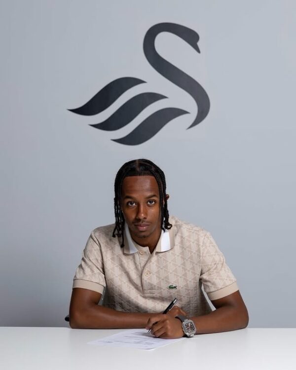 Kaleab Meron signing for Swansea City (Photo via Kal Meron on Instagram)