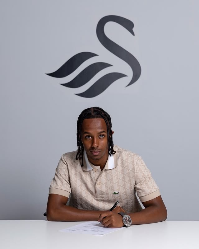 Kaleab Meron signing for Swansea City (Photo via Kal Meron on Instagram)
