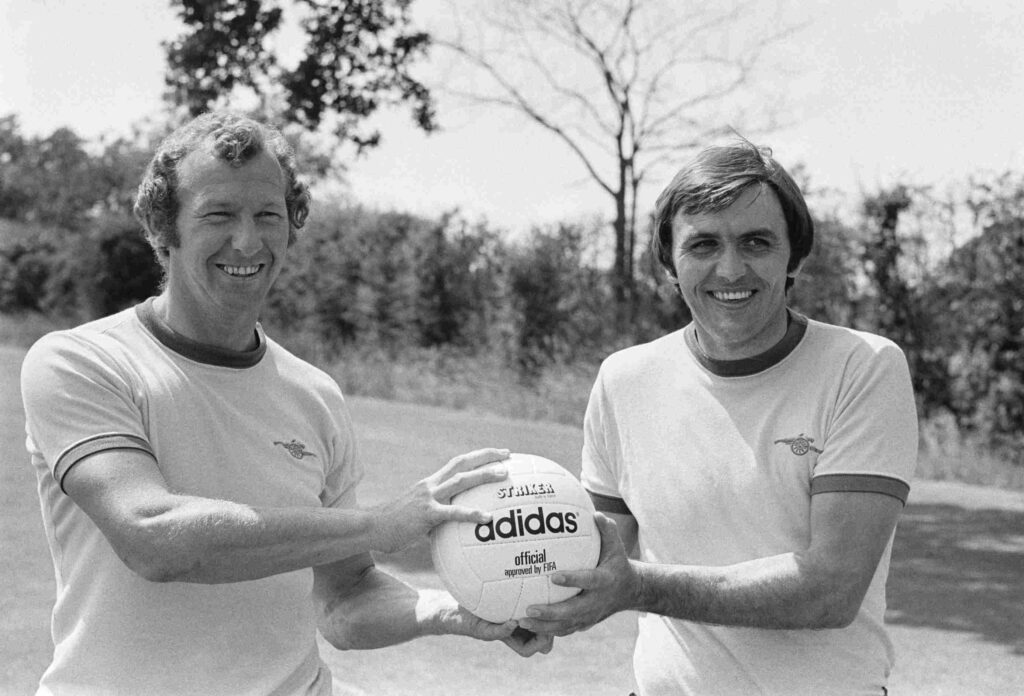 Former Arsenal keeper Jimmy Rimmer dies 3 Arsenal Football Club goalkeepers Bob Wilson, left, and Jimmy Rimmer smile while jointly holding a soccer ball at Arsenal FC's training ground in London Colney, Hertfordshire, July 6th 1977. (Photo by Mike Stephens/Central Press/Hulton Archive/Getty Images)