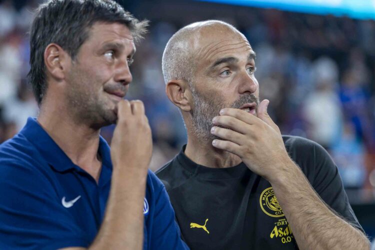 Head coach Enzo Maresca of Manchester City (R) and Team head coach Cristian Chivu (L) talk after the Manchester City v Inter Milan - Pre-Season Fri...
