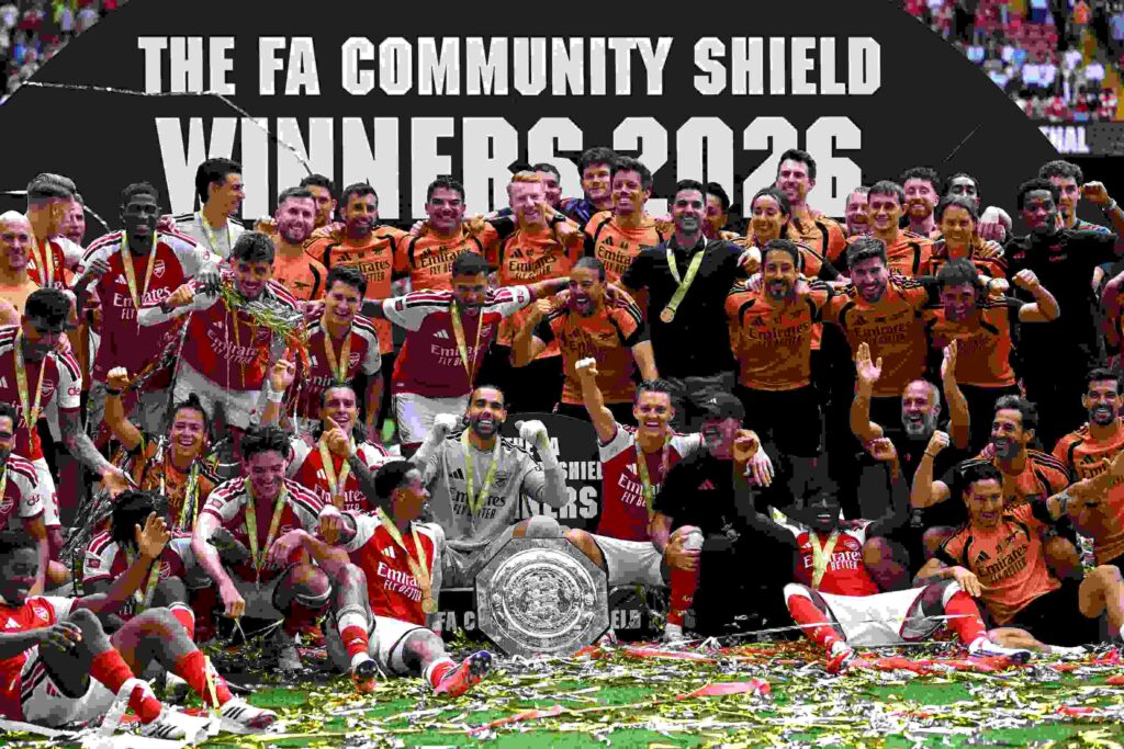 CARDIFF, WALES - AUGUST 16: Players and Staff of Arsenal celebrate together following the team's victory in the 2026 FA Community Shield match between Arsenal and Manchester City at Principality Stadium on August 16, 2026 in Cardiff, Wales. (Photo by Shaun Botterill/Getty Images)