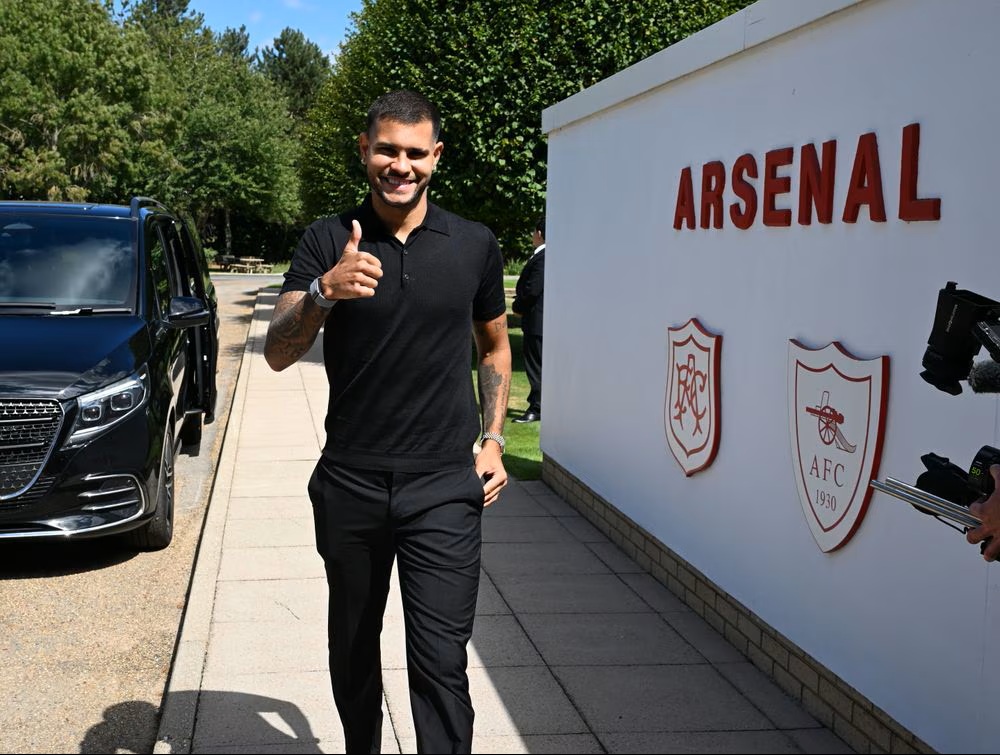 Bruno Guimaraes signing for Arsenal (Photo via Arsenal.com)