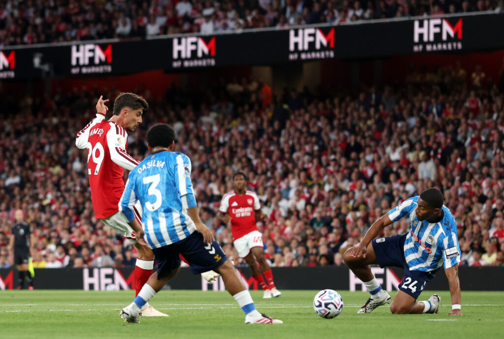 LONDON, ENGLAND - AUGUST 21: Kai Havertz of Arsenal scores his team’s first goal under pressure from Jay Dasilva and Aurele Amenda of Coventry City during the Premier League 2026/27 match between Arsenal FC and Coventry City at Emirates Stadium on August 21, 2026 in London, England. (Photo by Julian Finney/Getty Images)