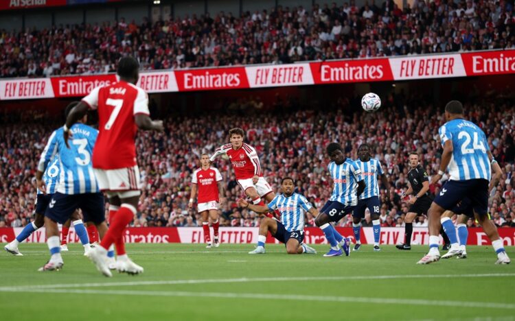 Christos Tzolis of Arsenal shoots under pressure from Milan van Ewijk of Coventry City during the Premier League 2026/27 match between Arsenal FC a...