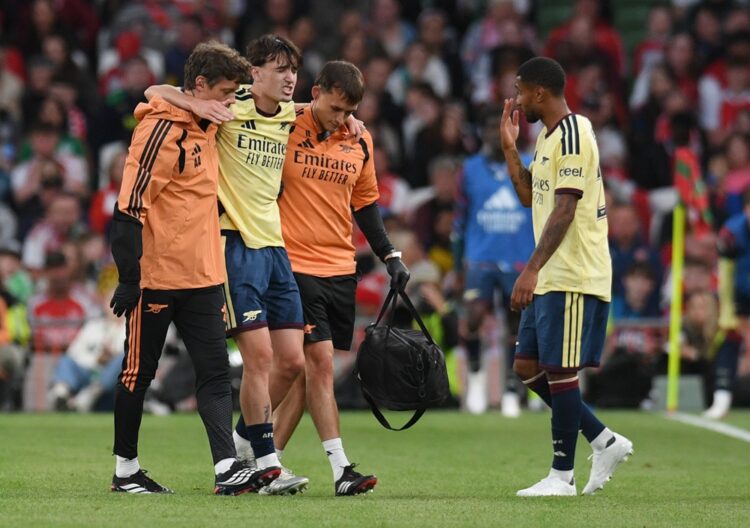 Louie Copley of Arsenal FC is helped off after sustaining an injury during the pre-season friendly match between Arsenal FC and Real Betis Balompie...