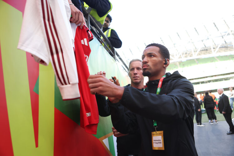 DUBLIN, IRELAND - AUGUST 05: Ethan Nwaneri of Arsenal FC signs autographs for fans before the pre-season friendly match between Arsenal FC and Real...
