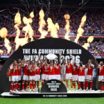 CARDIFF, WALES - AUGUST 16: Martin Odegaard of Arsenal lifts the FA Community Shield trophy with teammates after the 2026 FA Community Shield match between Arsenal and Manchester City at Principality Stadium on August 16, 2026 in Cardiff, Wales. (Photo by Shaun Botterill/Getty Images)